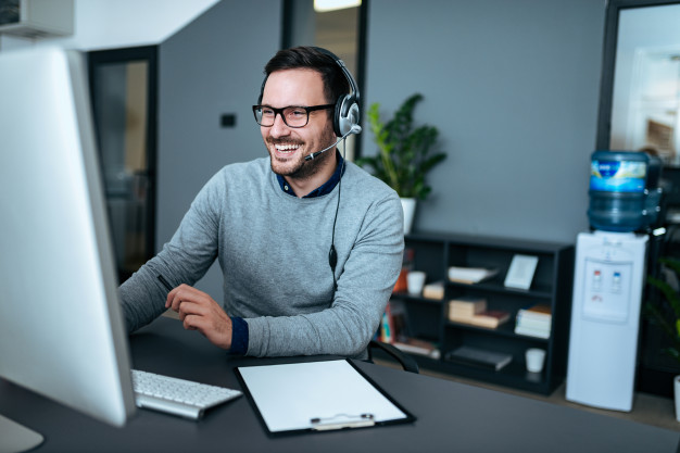a man work infront of computer